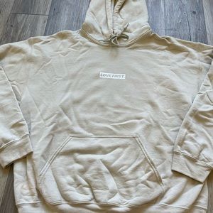 “love first” hoodie
